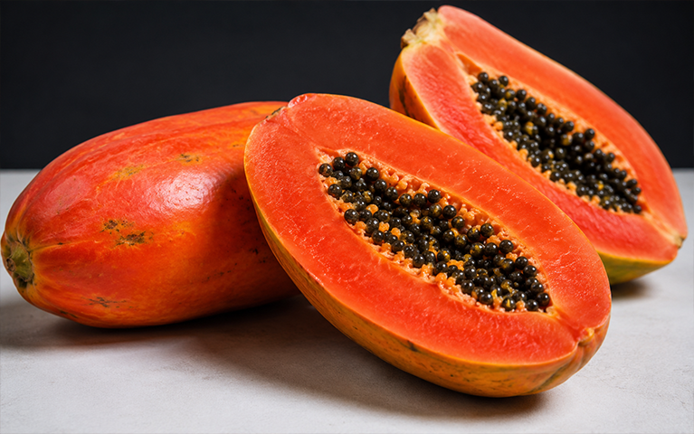 Ripe red papaya with orange flesh and black seeds for export